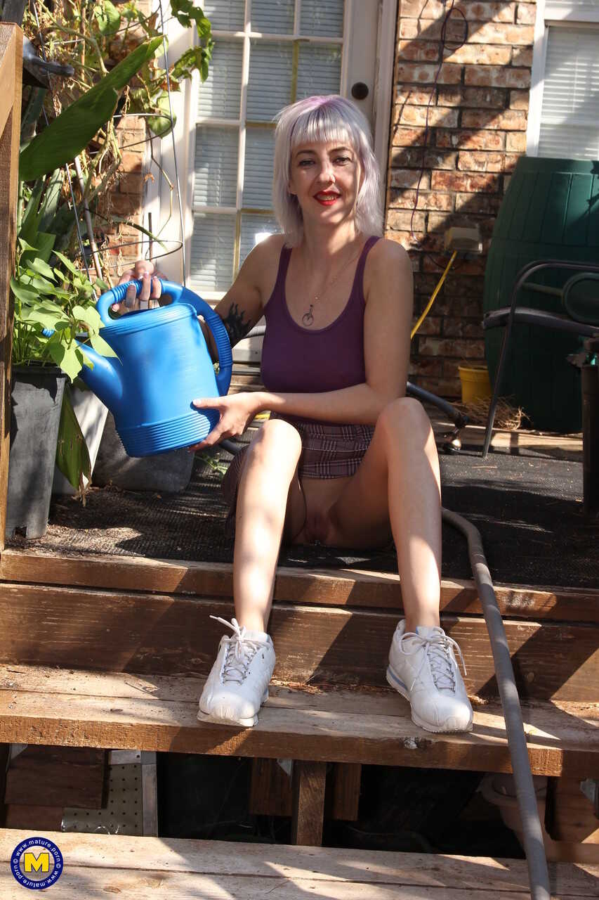 The Naughty Neighborhood Garden: Skinny Blonde Sylvie J Flashes Her Pussy In Public! - Sylvie J