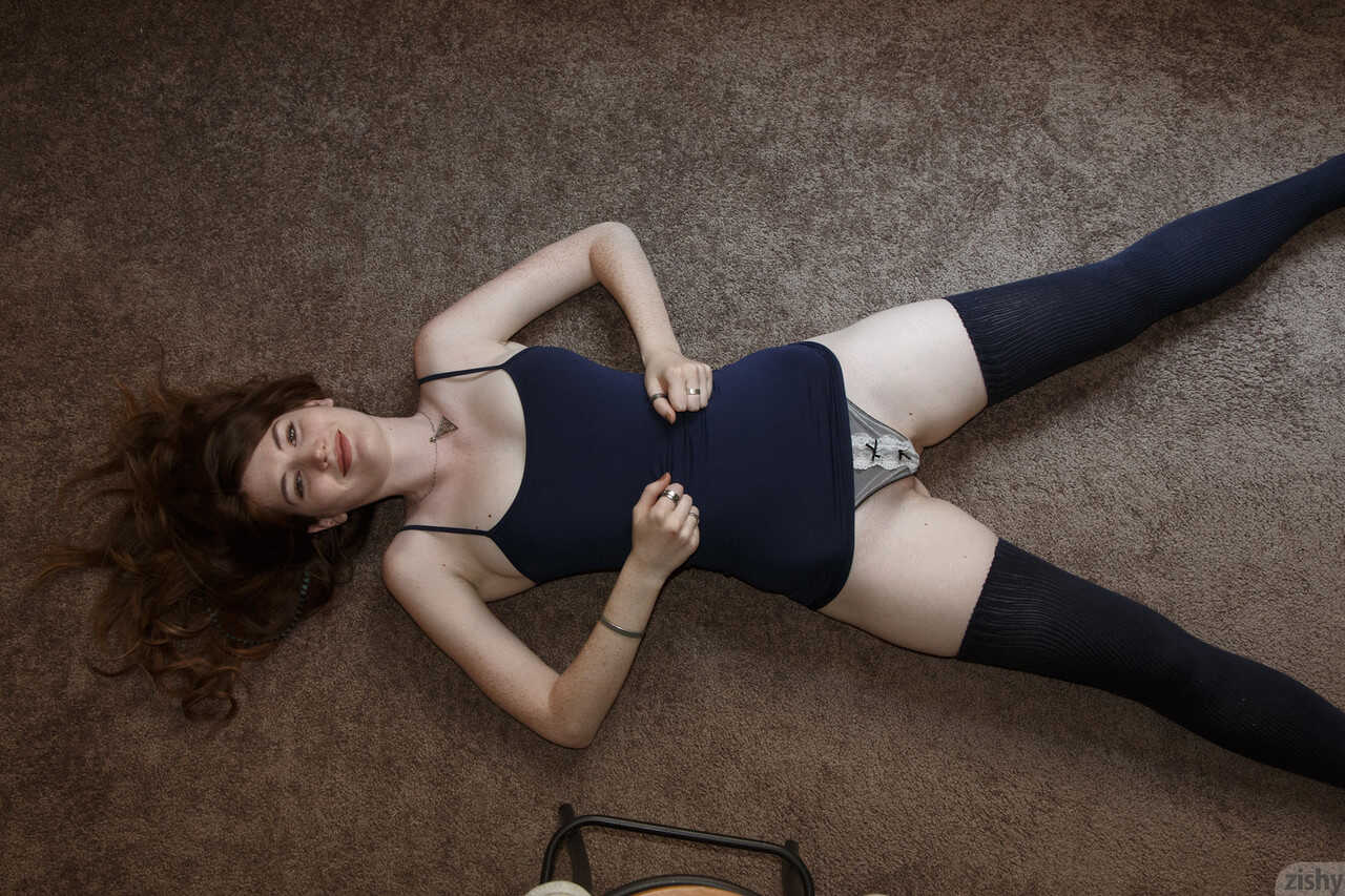 Watch as sexy redhead teen Zoe Fletcher flaunts her petite tits and toned ass in a skimpy thong panties! - Zoe Fletcher