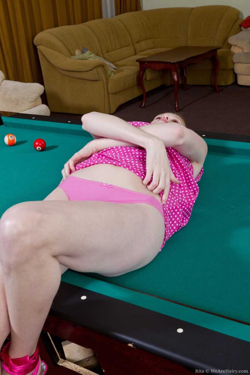 Blonde tease Rita hops on the pool table to strip & show her hairy ginger clam - Rita