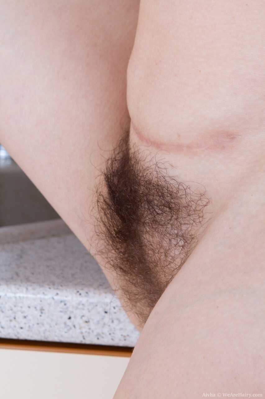Blonde Bombshell: Tall Aivha Fingers Her Hairy Muff on the Kitchen Counter - Aivha