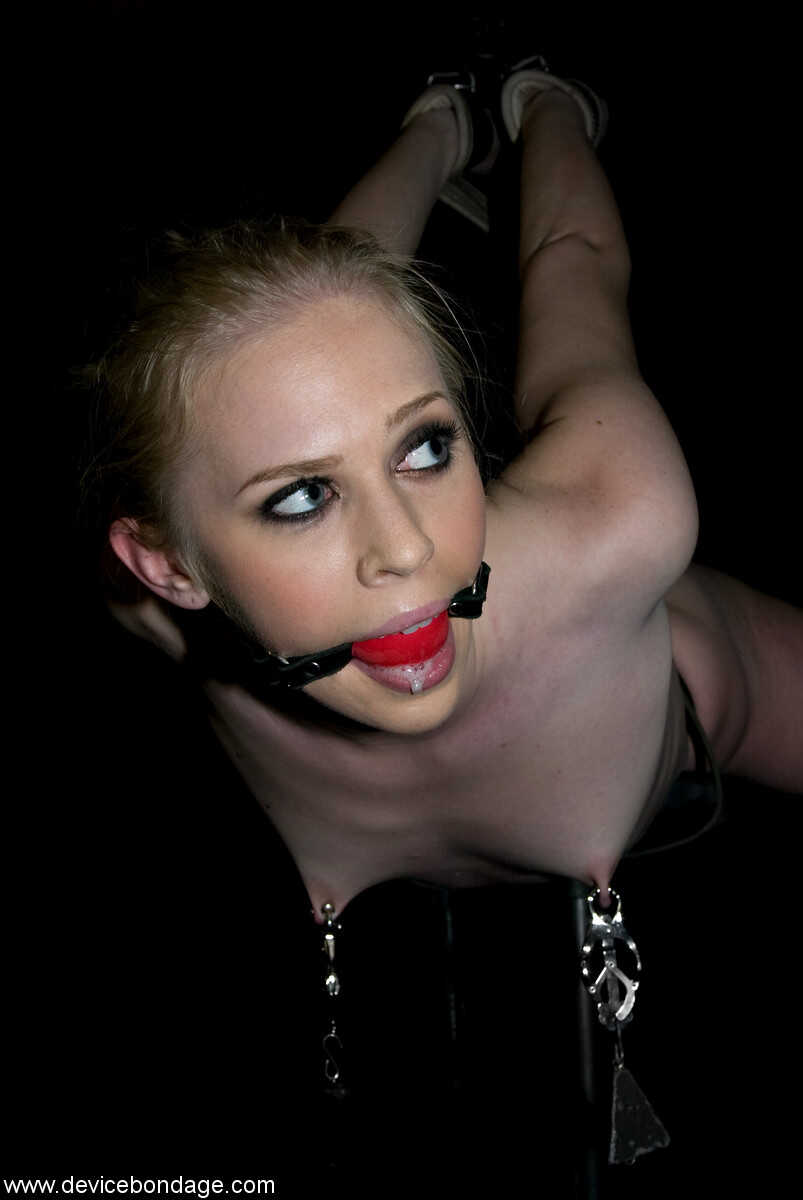 Blonde MILF Samantha Sin is bound and tortured in this intense BDSM scene featuring her petite feet and beautiful face as she moans and squirms while her nipples are weighted.