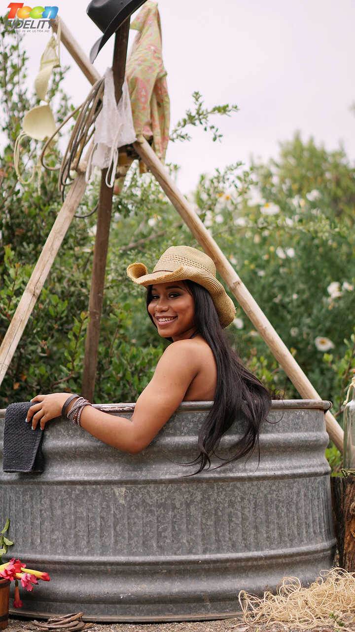 Ebony cowgirl Jenna J Foxx with juicy tits rides married man's cock reverse while he watches her big black pussy boun...
