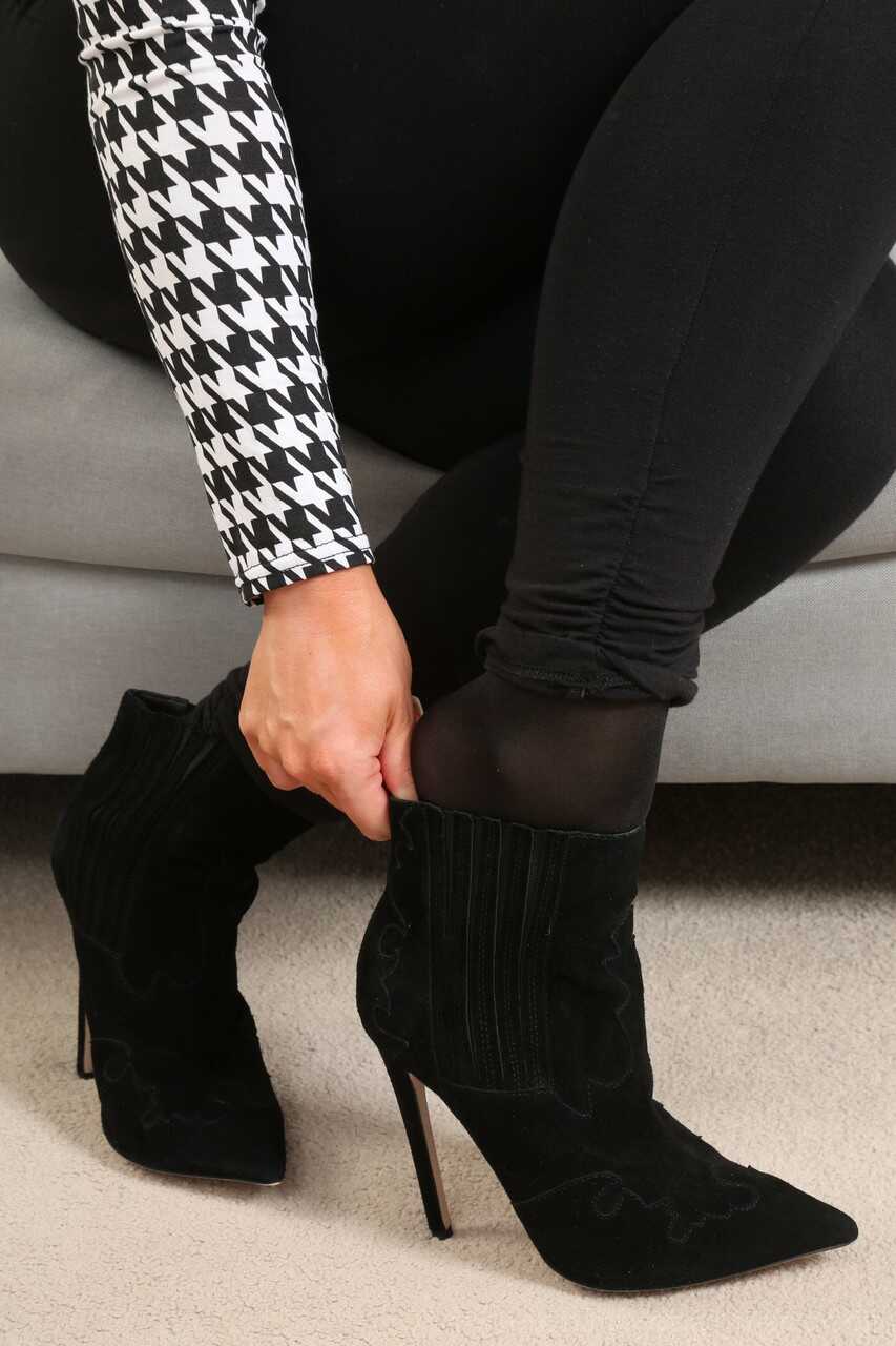 Busty seductress Amy S strips to her sheer black tights and poses topless in her high heels - Amy S