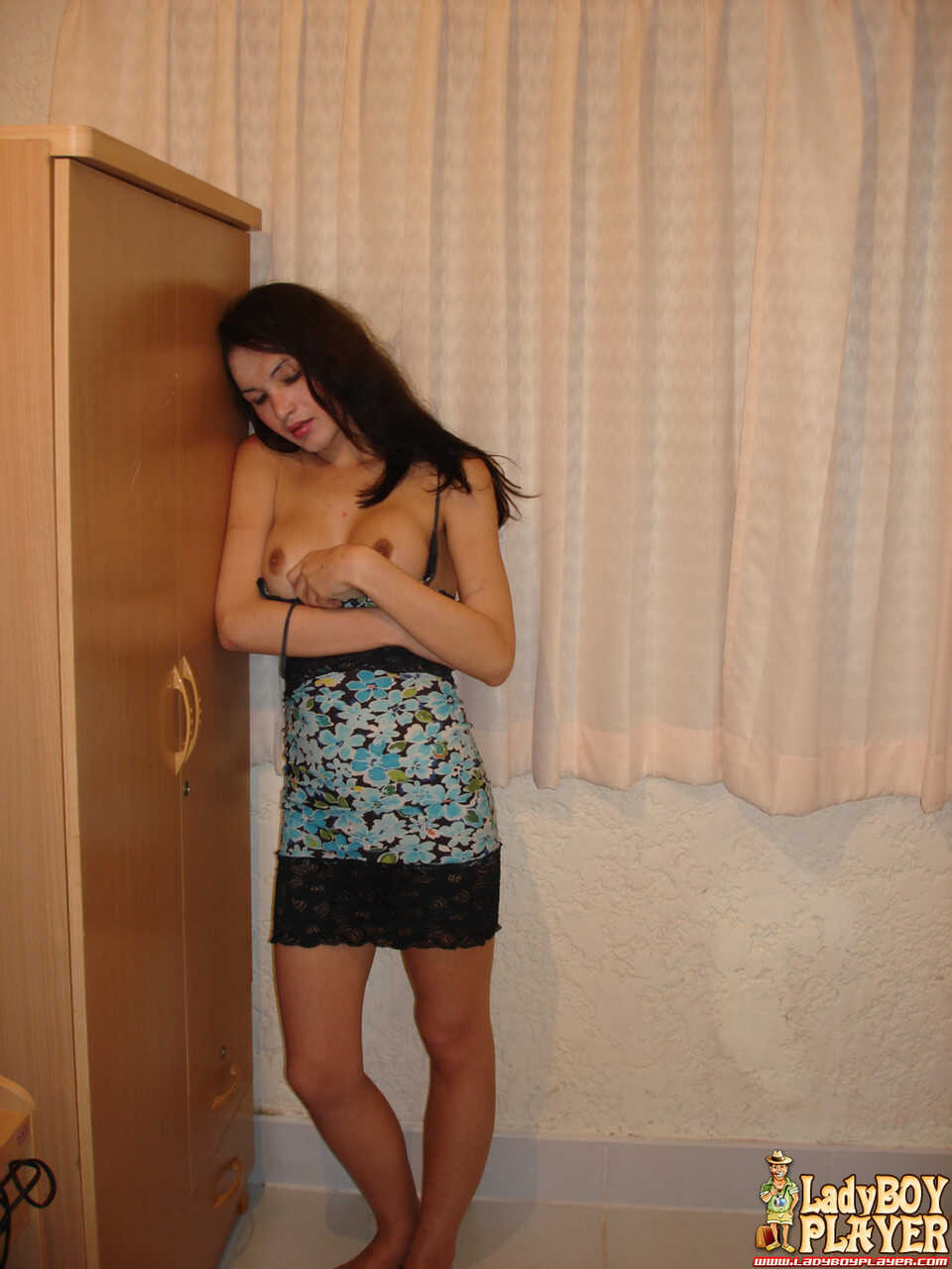 Lisa's Delicious Dong Tease: A Skinny Teen Tranny with Fake Boobs Shows Off Her Thai Ladyboy Goodies on a Bed - Lisa