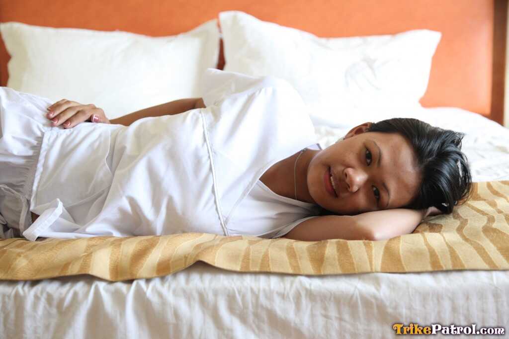 Lusty Filipina Nurses Joanna and Joy Pose on the Bed in Their White Uniforms As The Asian Beauties Explore Each Other&#039...