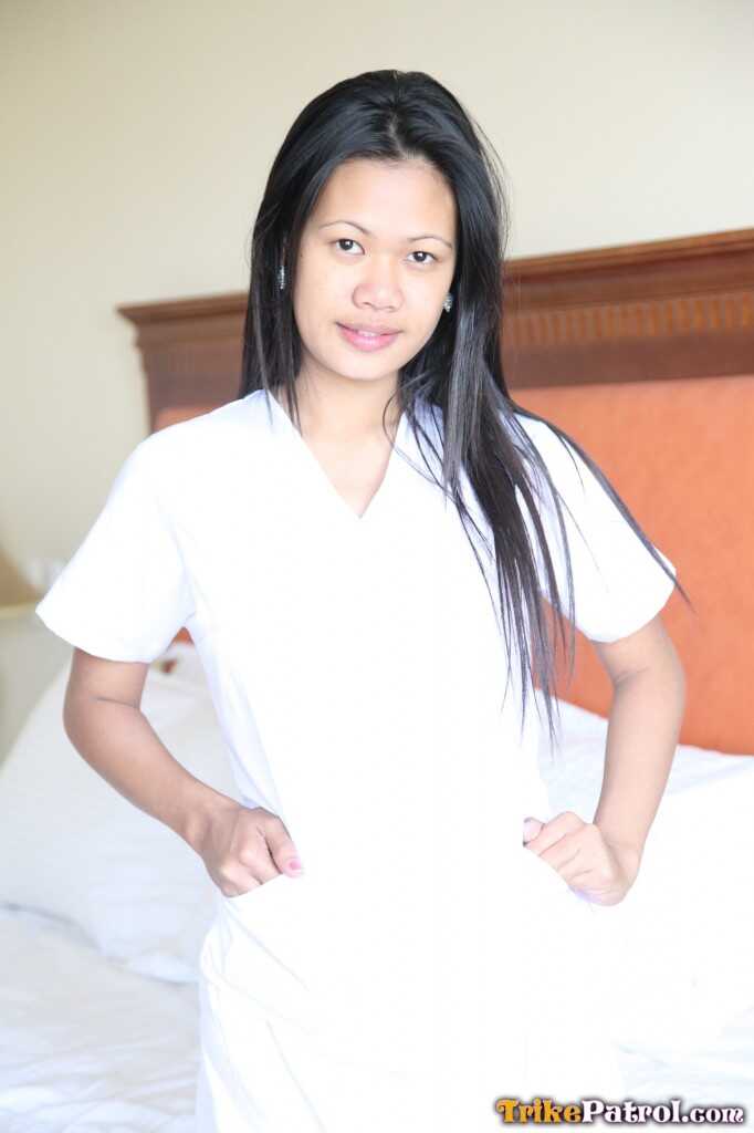 Lusty Filipina Nurses Joanna and Joy Pose on the Bed in Their White Uniforms As The Asian Beauties Explore Each Other&#039...