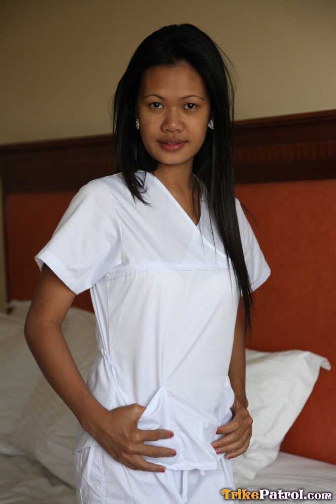 Lusty Filipina Nurses Joanna and Joy Pose on the Bed in Their White Uniforms As The Asian Beauties Explore Each Other&#039...