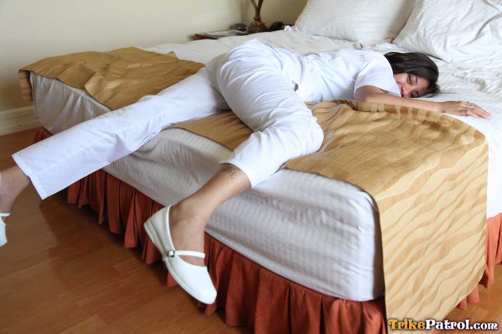 Lusty Filipina Nurses Joanna and Joy Pose on the Bed in Their White Uniforms As The Asian Beauties Explore Each Other&#039...
