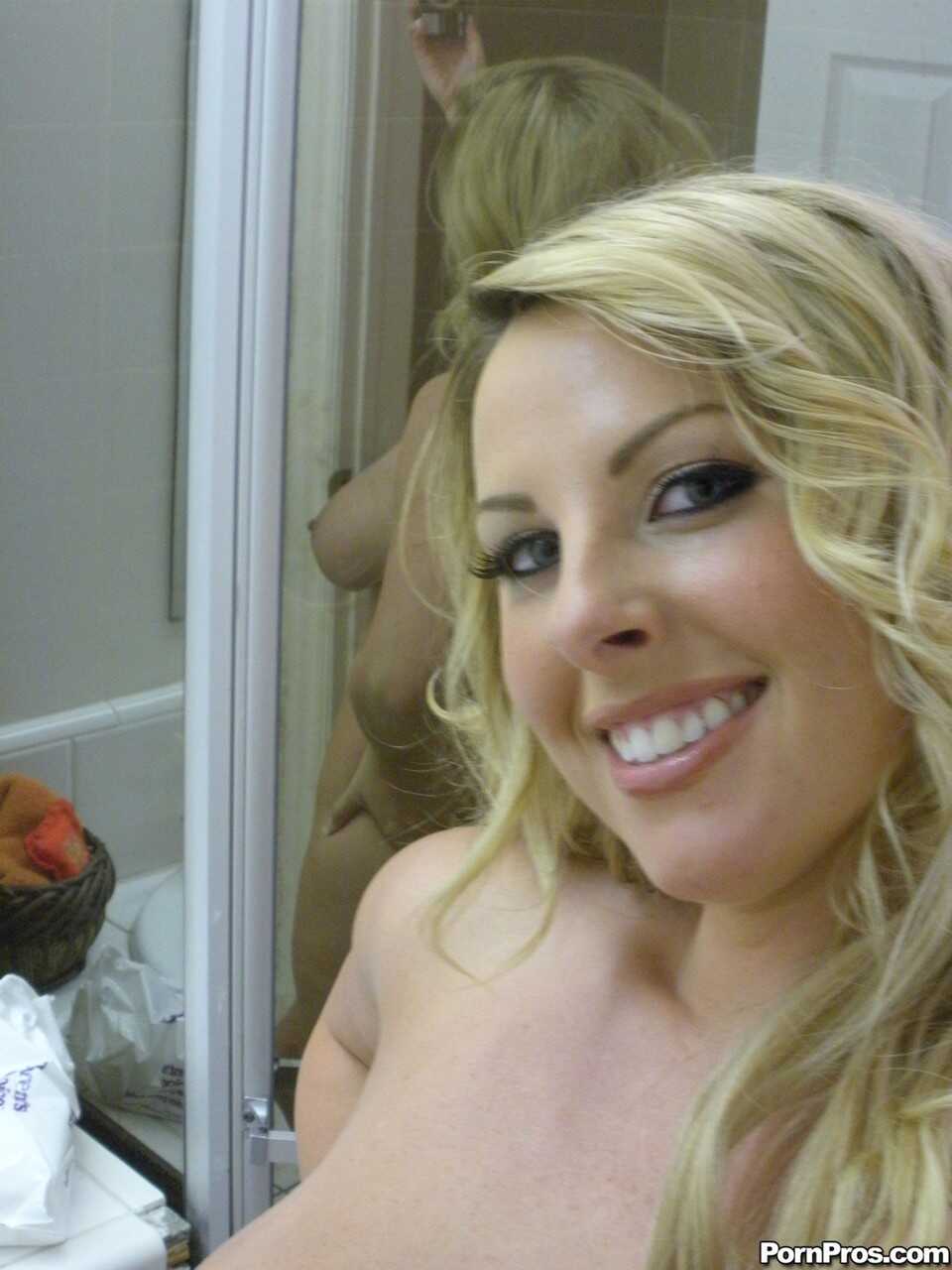 Blonde bombshell Stephanie Blaze shows off her perfect tits in the mirror