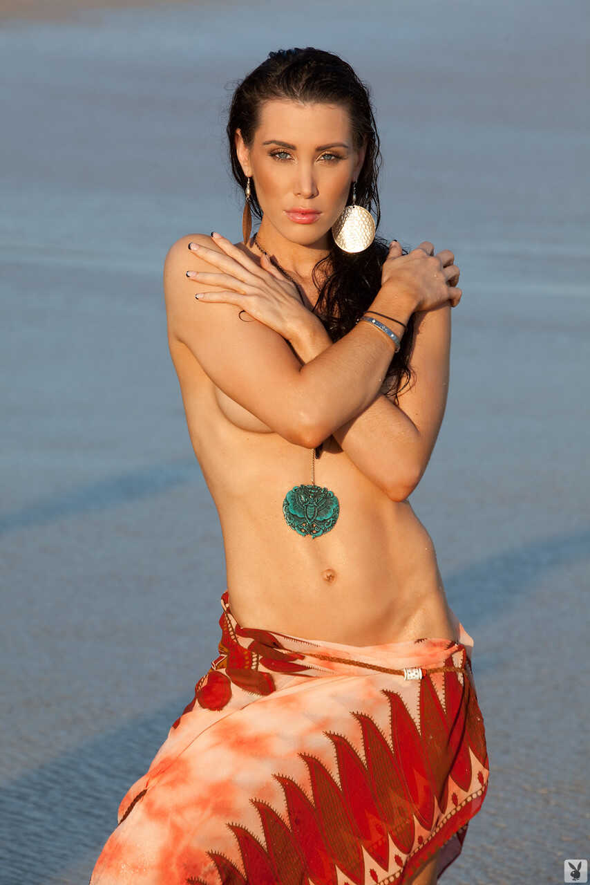 Busty brunette beauty Kristy Joe Muller shows off her big tits on the sandy shore - Kristy Joe Muller