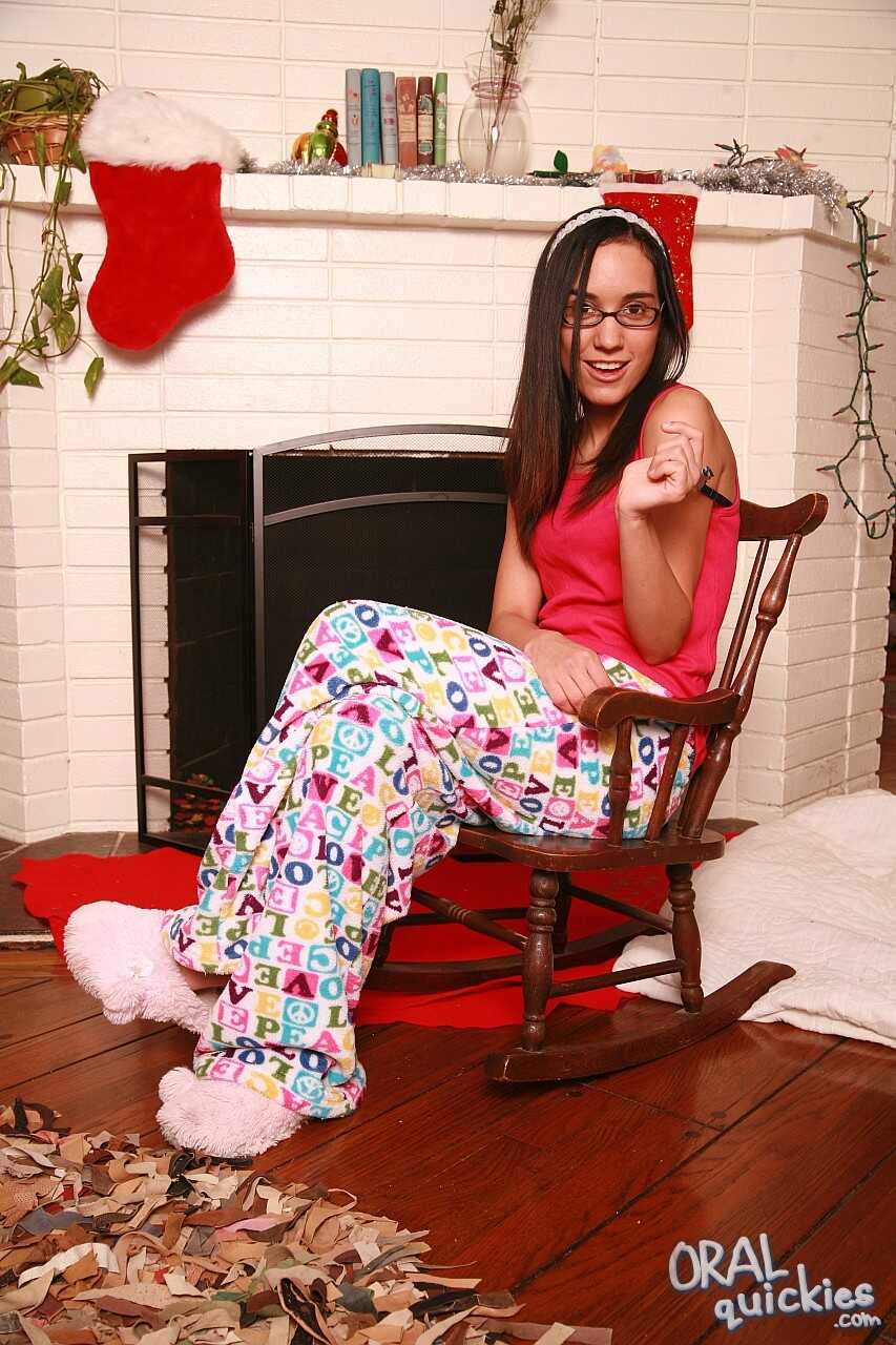 Nerdy Latina Tia Cyrus Gives Her Boyfriend a Double Penetration Blowjob while Wearing a Skin-tight Santa Suit by the Firep...