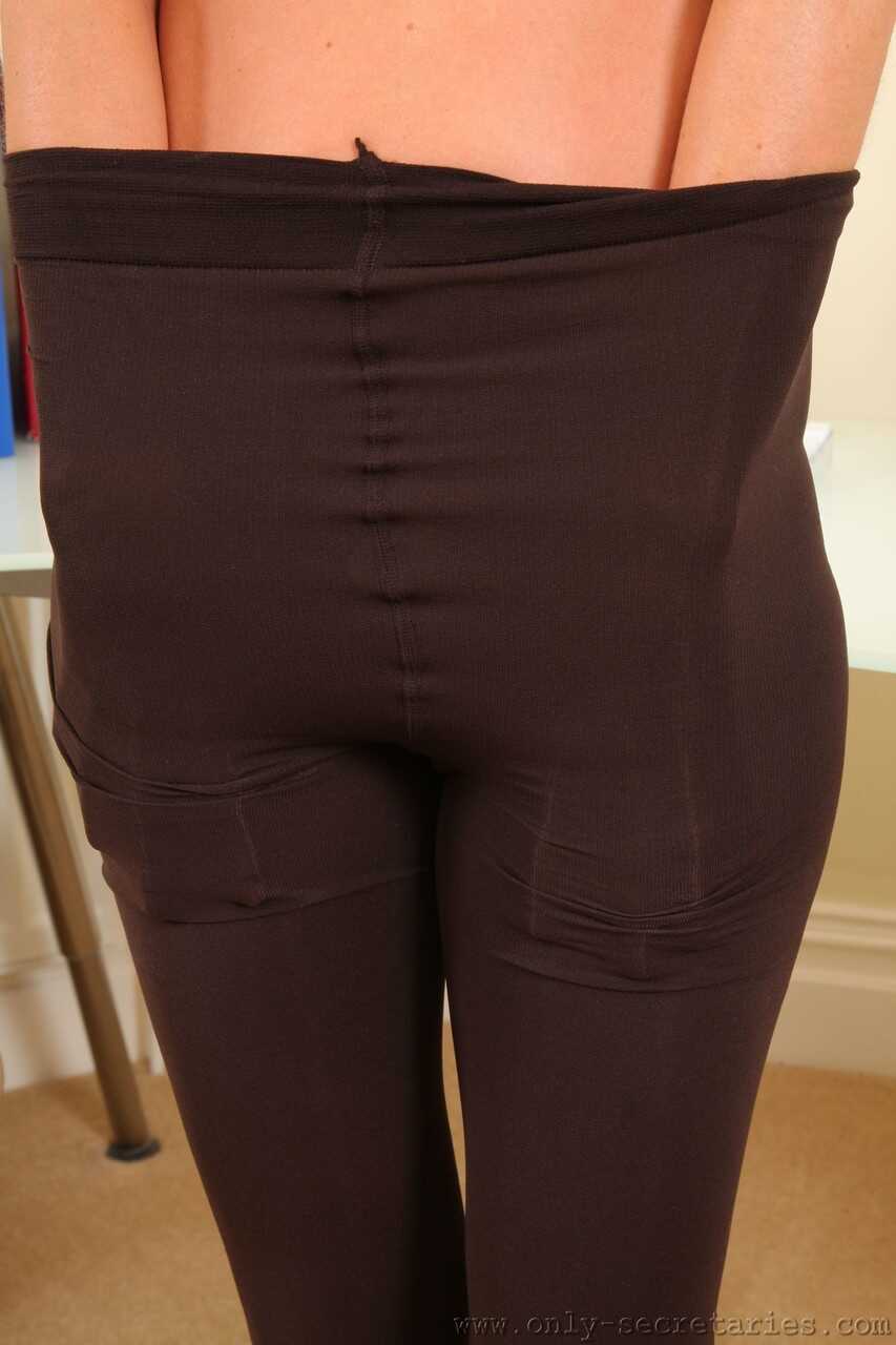 Sexy MILF Melanie removes her red dress and black boots to show off big juggs while wearing pantyhose - Melanie Walsh