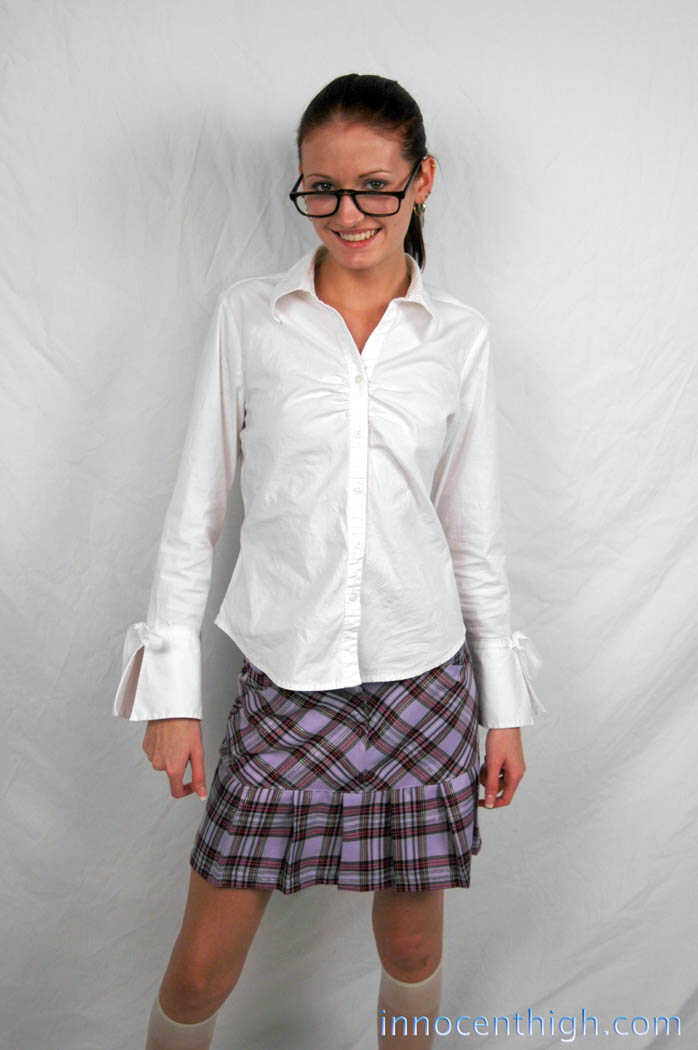 Hailey Young, the skinny nerd MILF, flashes her white panties in her schoolgirl uniform while posing for her hot young nei...