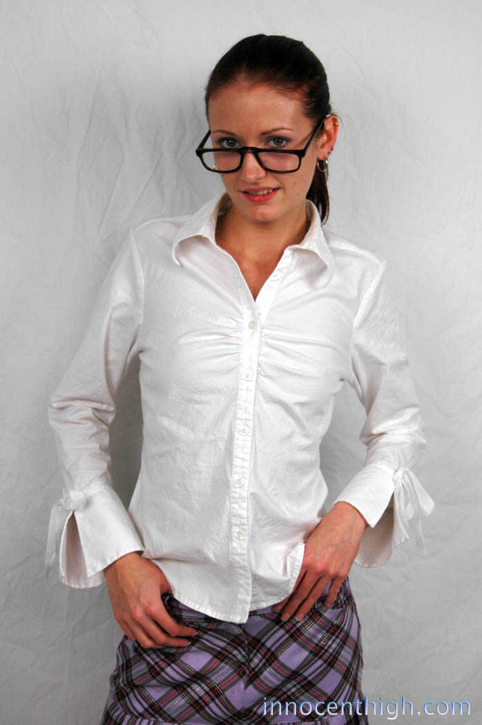 Hailey Young, the skinny nerd MILF, flashes her white panties in her schoolgirl uniform while posing for her hot young nei...