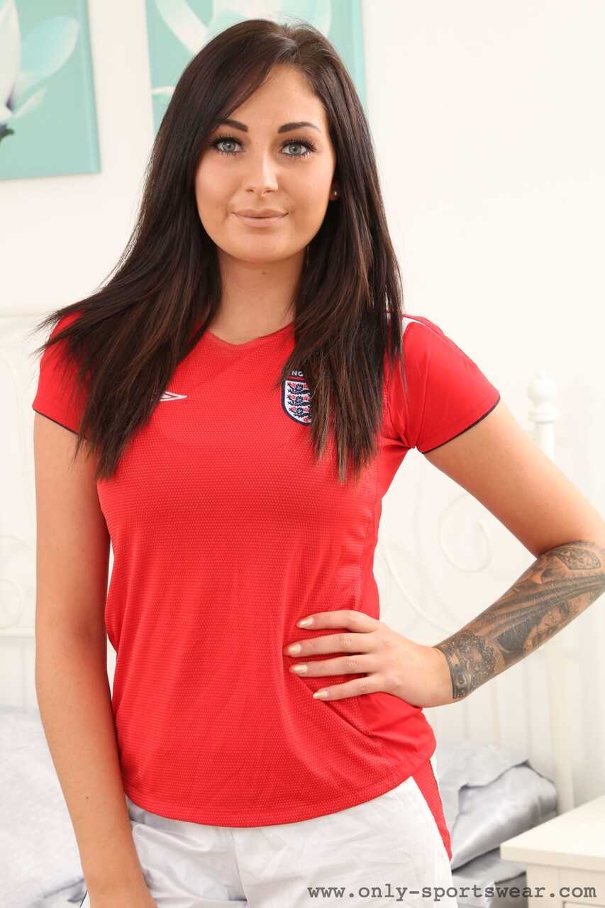 Lauren The Stylist removes her soccer jersey to reveal a tight fitting sports bra, exposing her perfectly shaped breasts a...