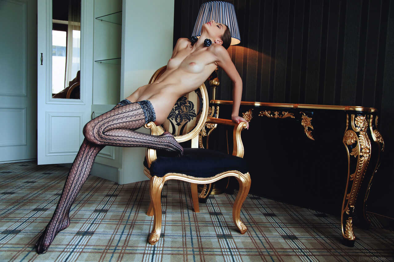 The Ukrainian babe with the gorgeous face and slender body Loretta A poses on an armchair in hot naked girls - Loretta A