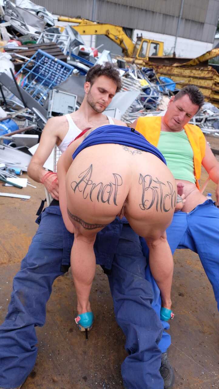 Redhead MILF with tattoos and fake tits gets banged in a junk yard 3some  Julia Exclusive: Junkyard Inktoberfest OR Julia Exclusive: Tatted-up Temptress Gets Gangbanged in the Garage