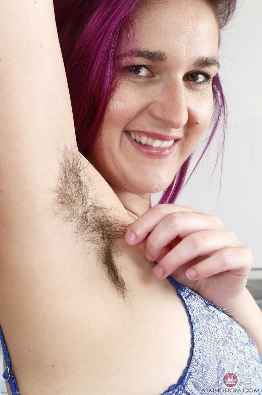 Purple-haired bitch KoKo Kitty flaunts her hairy armpits and bushy crotch for the camera!