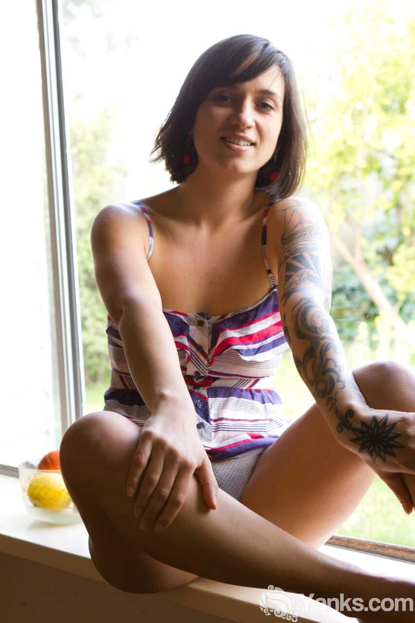 Liandra Dahl shows off her tattoos as she strips down to her panties on a sunny day. - Liandra Dahl