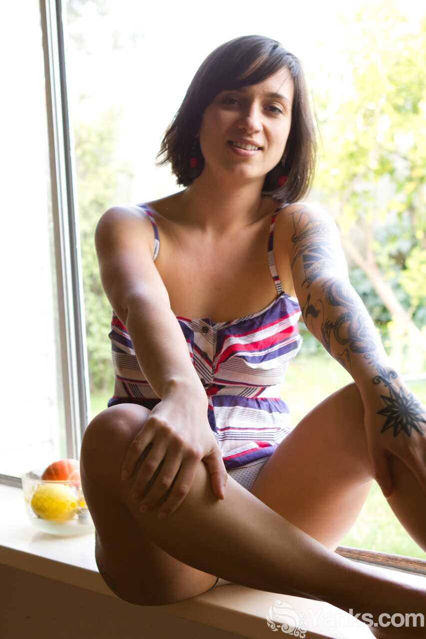 Liandra Dahl shows off her tattoos as she strips down to her panties on a sunny day. - Liandra Dahl