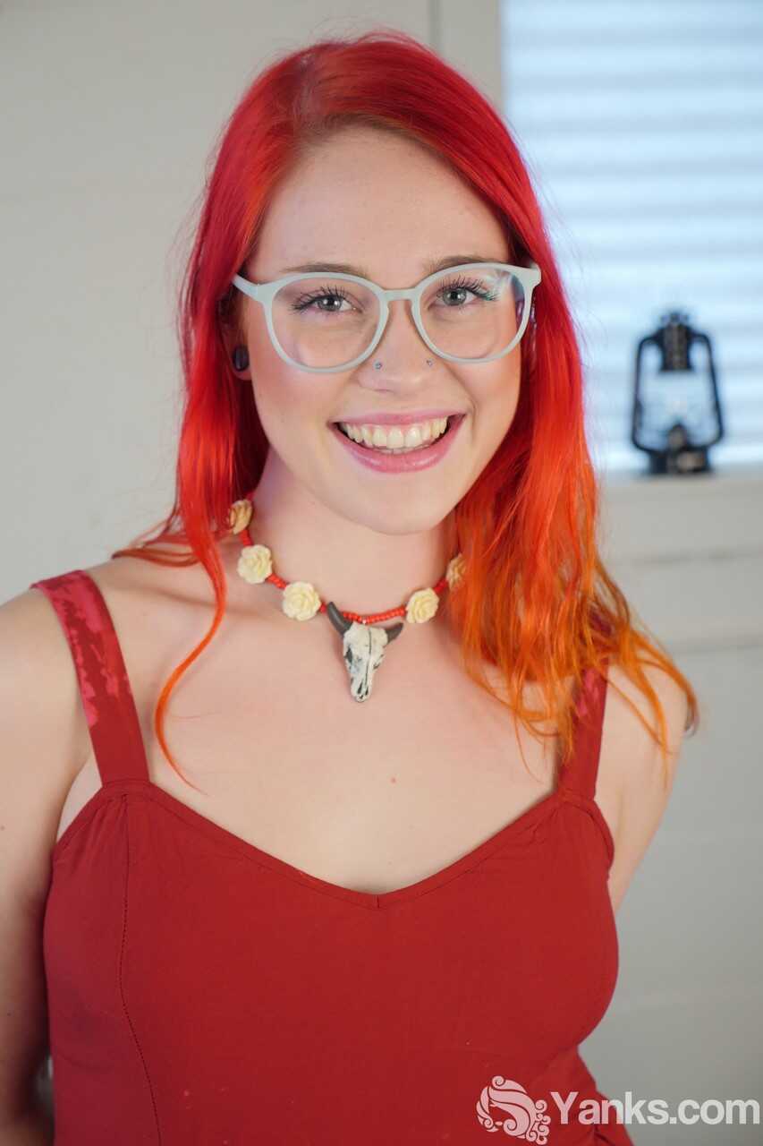 Adorable redhead Jennavive Marie gets fucked by a big dildo while teasing her glasses-clad eyes in a solo masturbation ses...