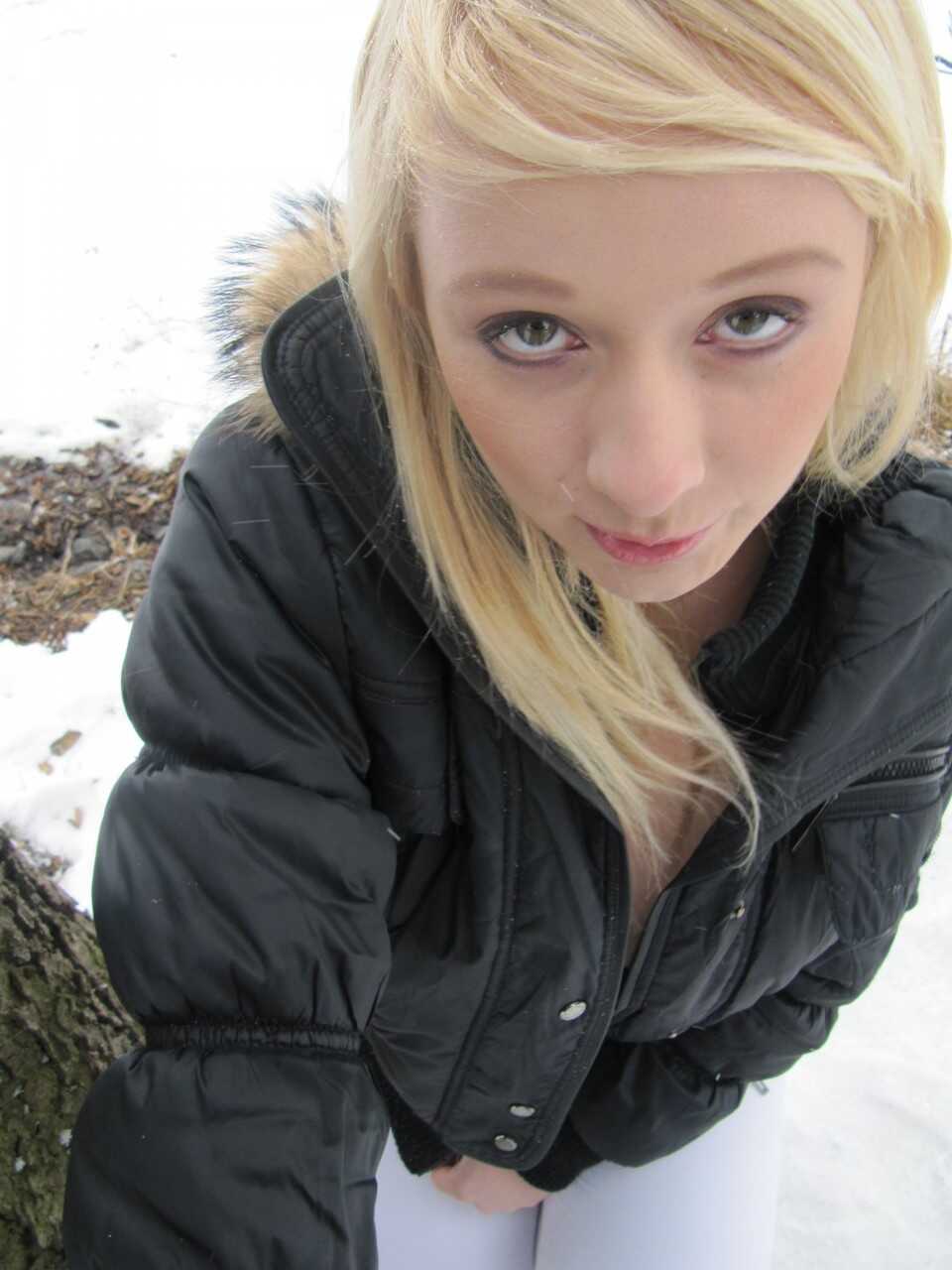 Pretty blonde teen Tonya shows off her juicy tits and fine ass in the great outdoors