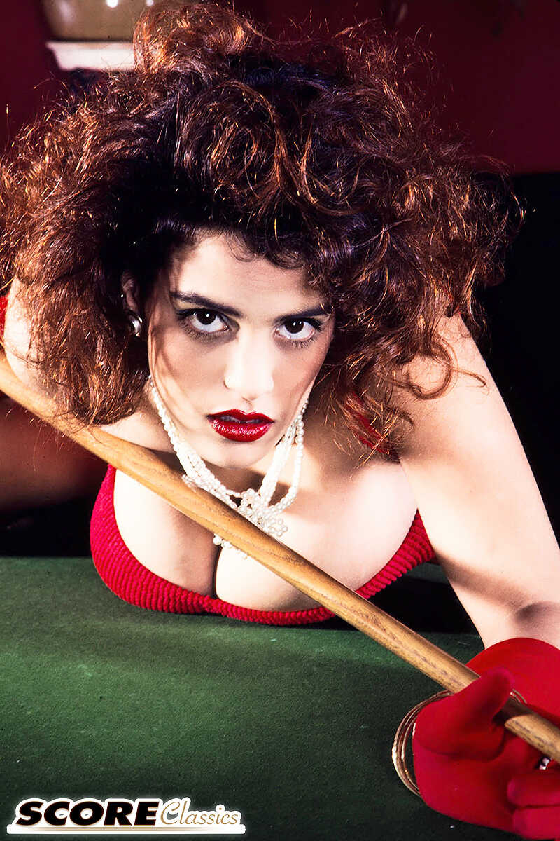 Lady-vamp with big boobs Nilli Willis' hairy mound meets the gloved touch of her hand on a pool table, leaving a stic...
