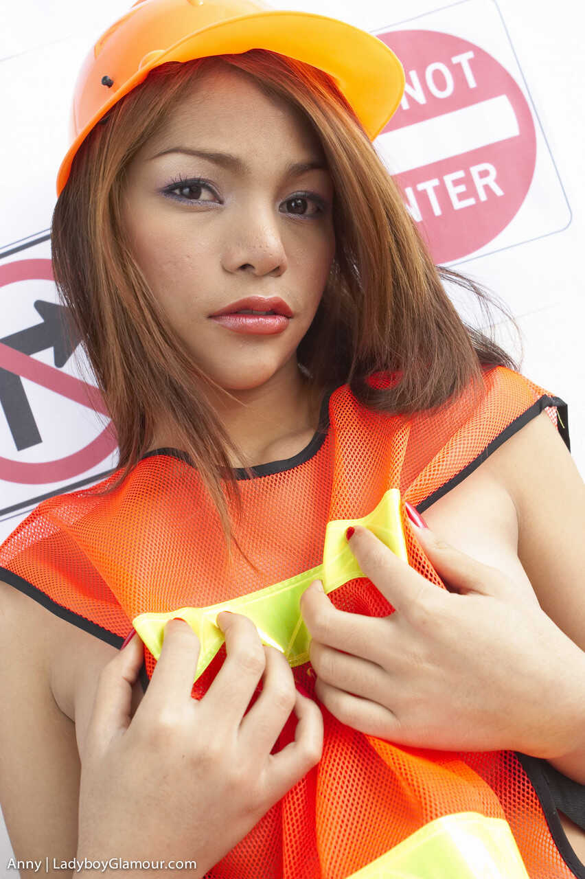 Construction worker tranny Anny's tiny cock meets her fake tits in the construction site - Anny