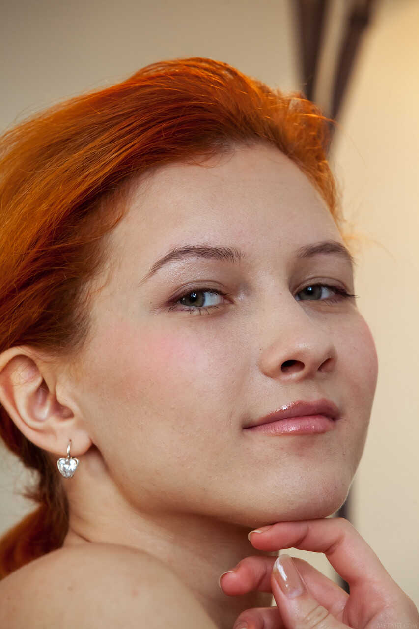 Skinny redheaded babe Ambre poses nude in a solo, revealing her petite pussy and teen ass - Ambre