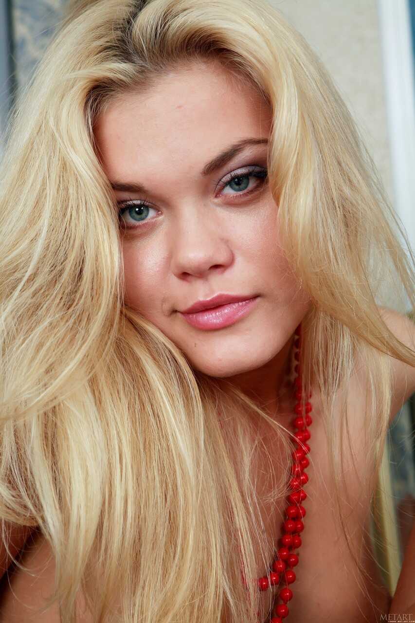 Golden-haired Beauty Flora A Loses Her Red Lingerie and Poses Nude for the Camera - Flora A