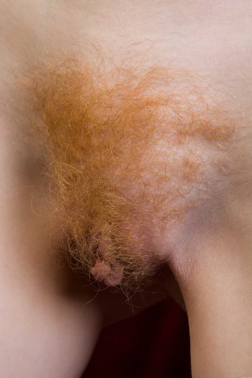 Curly-haired ginger Rochelle A strips naked & showcases her furry snatch a hairy redhead pussy you won't forget!