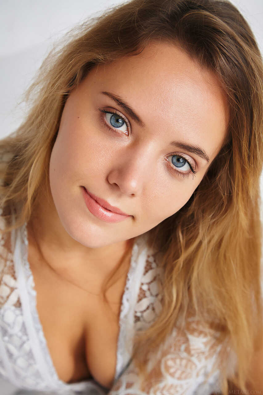 Blue eyed teen Mango A sucks her own tits and poses naked. - Mango A