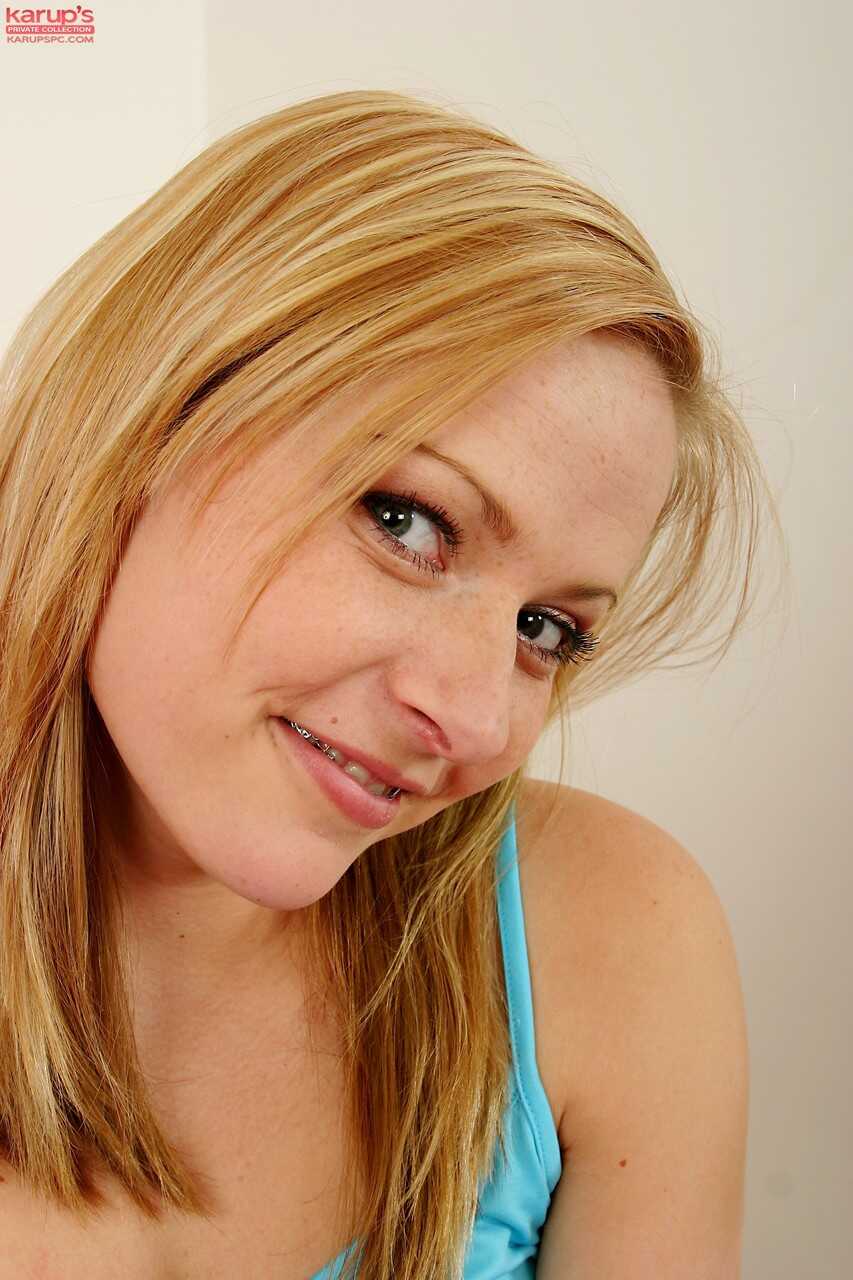 Blonde teen with braces Petra displaying her tiny boobs and innocent pussy - Petra 10