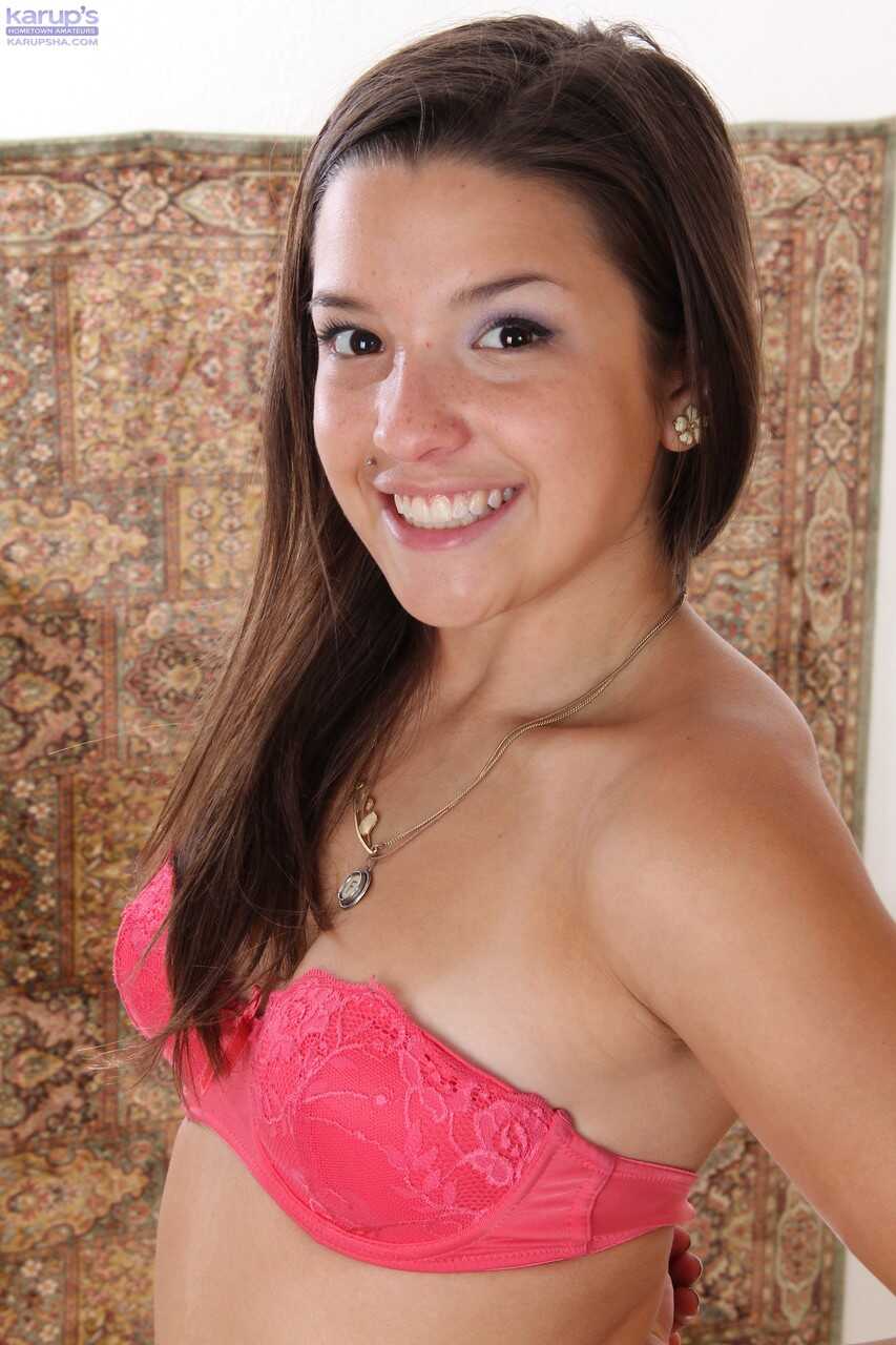 Petite Veronica in a Pink Outfit Tugs on Her Bald Vagina with a Toy While Soloing - Veronica Berry