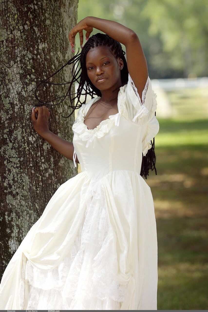 Ebony with amazing big tits Deserea doffs her dress and poses outdoors - Deserea