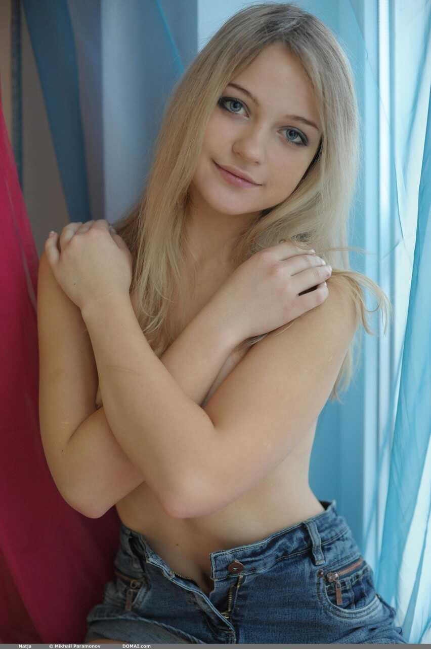Sweet Natja's Casual Nudity by the Window: A Naked Teen Blonde Skirt and Jeans Fetish - Natja