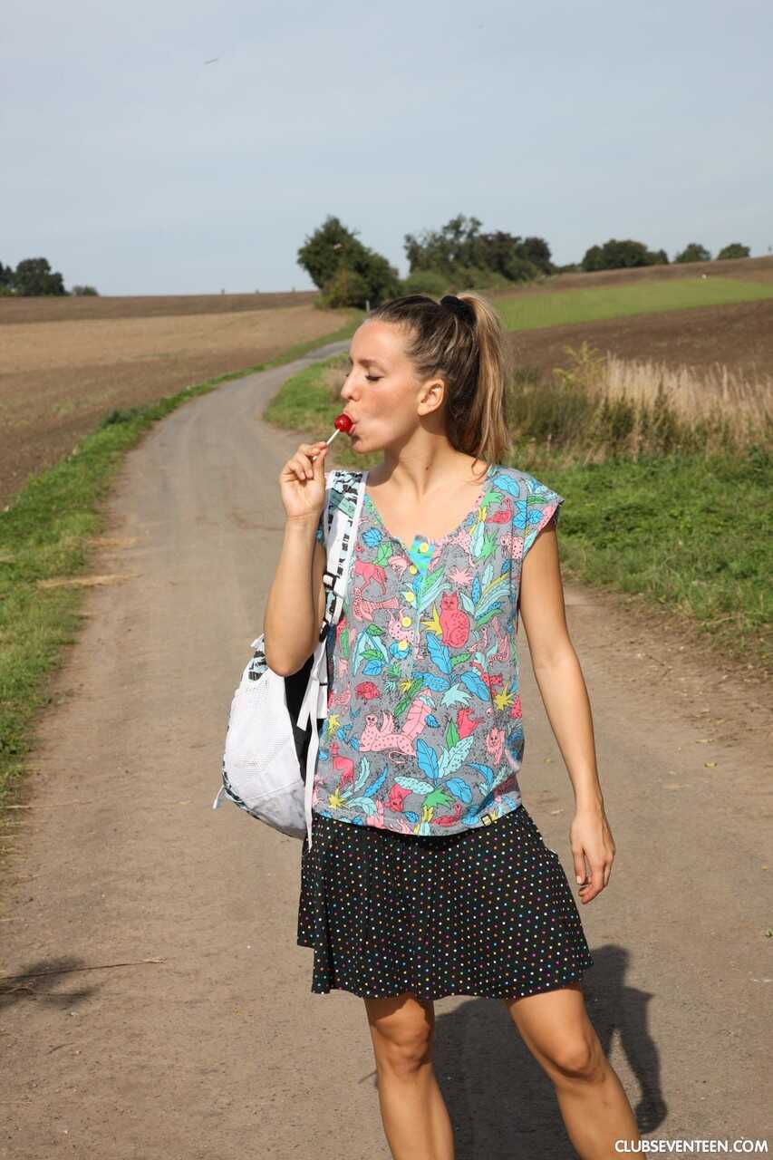 European Nessy Teen by the Road Licks and Masturbates with a Lollipop in Public