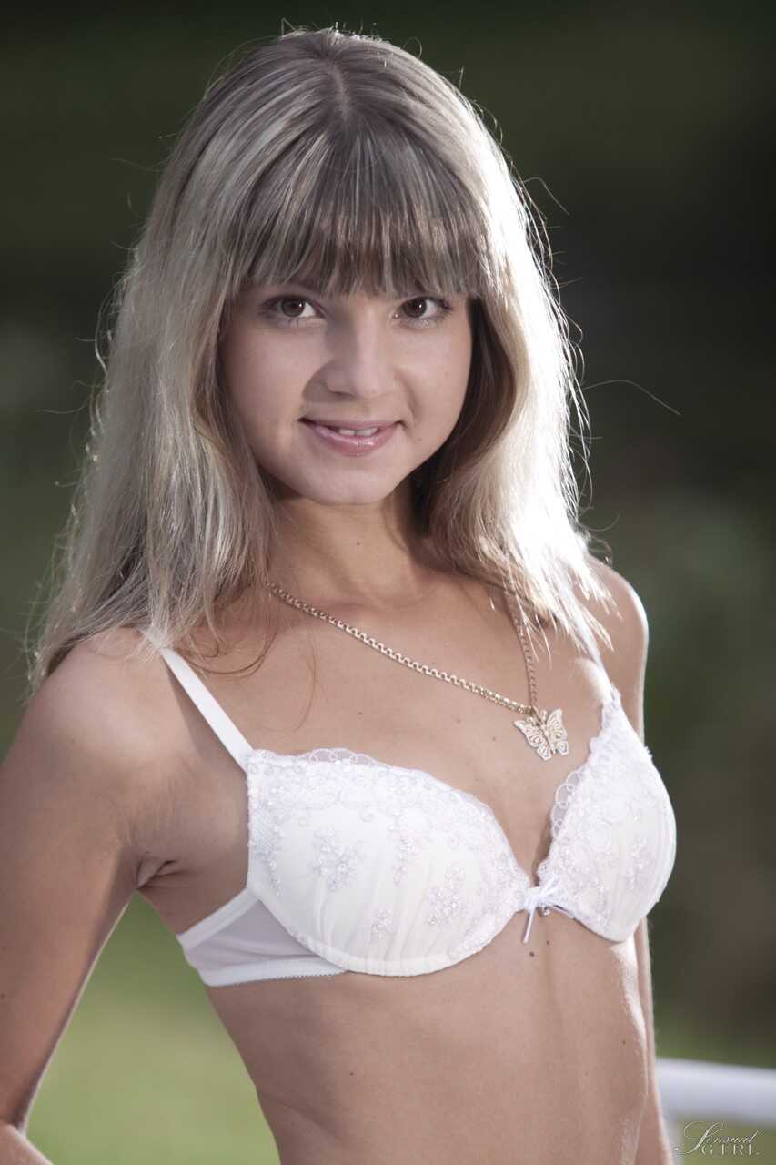Slim Russian teen Gina Gerson strips her sexy white lingerie outdoors and reveals her small tits and shaved pussy - Gina G...