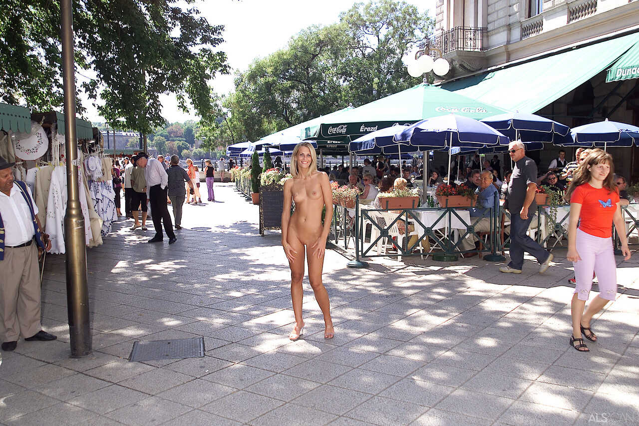Blonde teen Krisztina gets turned on and removes her yellow dress in public, flaunting her body for all to see! - Krisztina