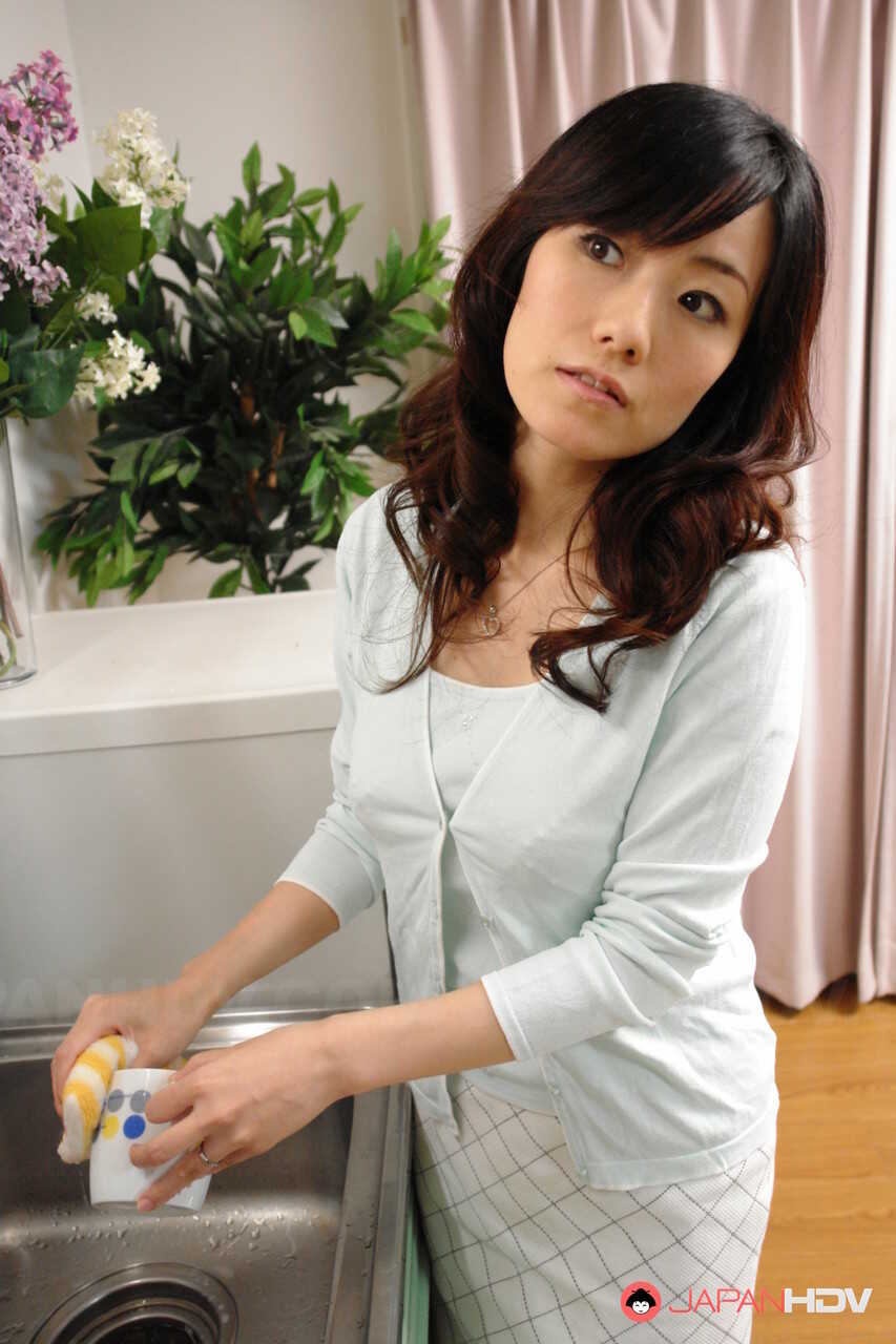 Asian wife Manami Komukai dominates her son's friend with a sensual massage and rough pussy ride - Manami Komukai