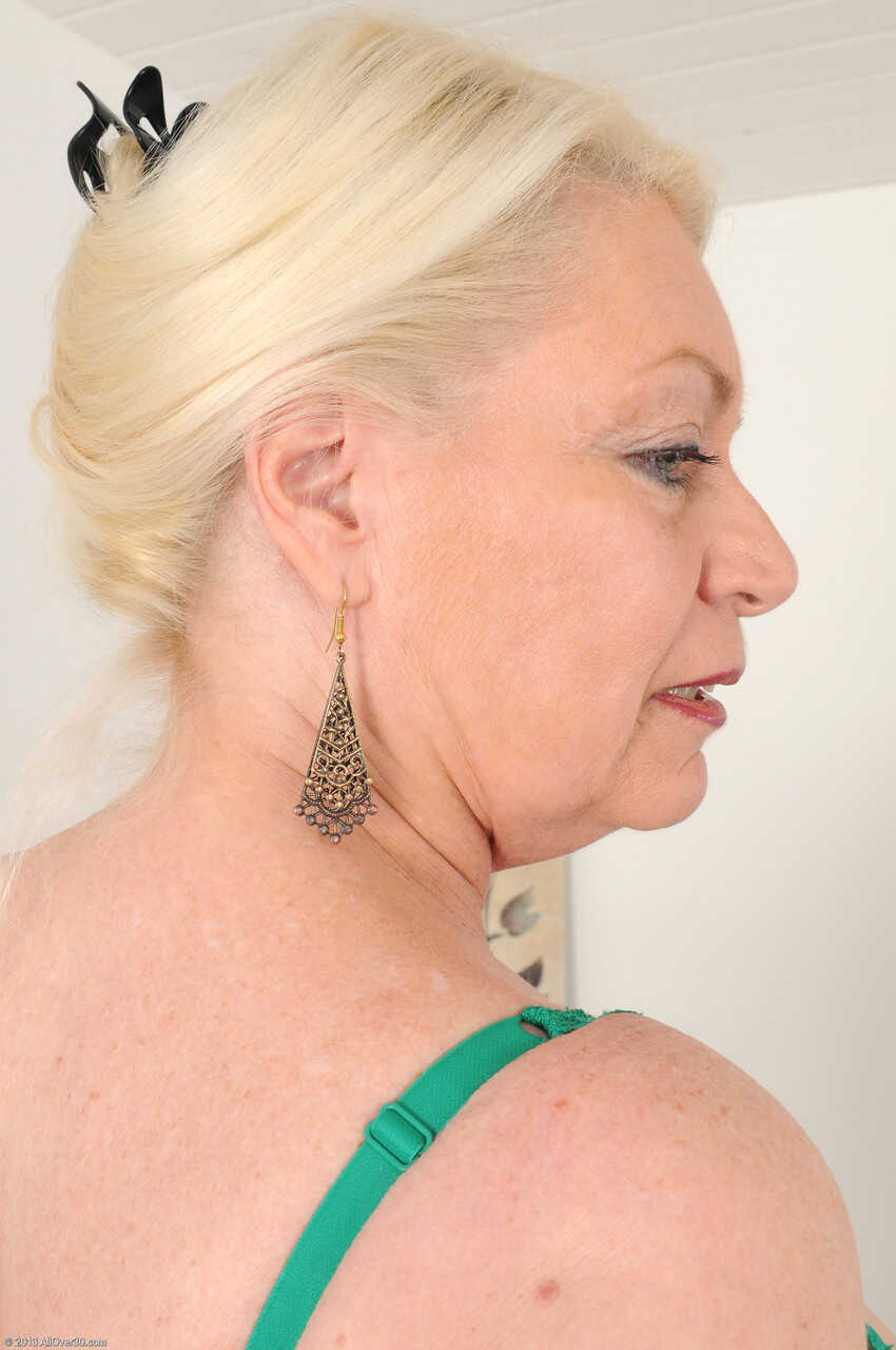 Fat granny with big pierced tits Angelique undresses and plays with her muff. - Angelique