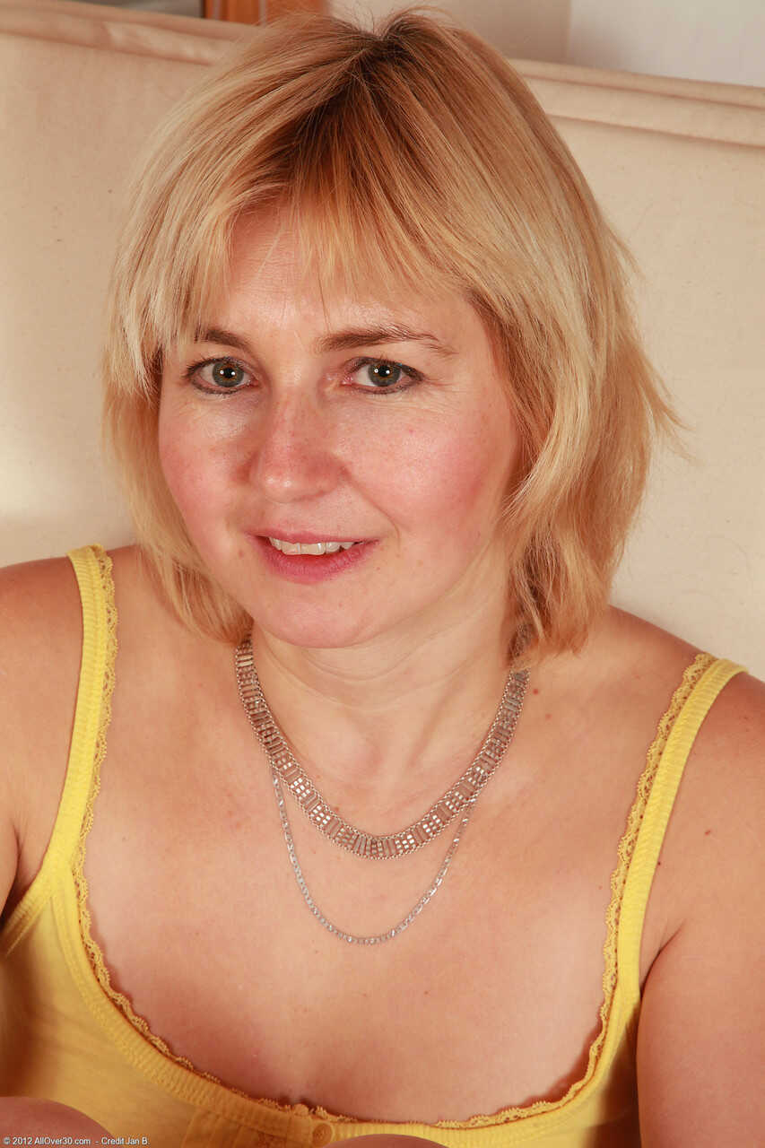 Mature Nella's saggy tits and pussy stripping show- Russian MILF Nella exposes her hairy pussy Nella's big saggy...