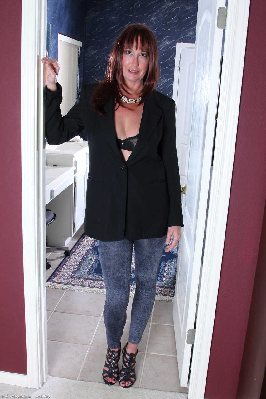 Chubby amateur MILF Jaden strips her blue jeans and plays with her pussy lips while showing off her mature feet and spread...