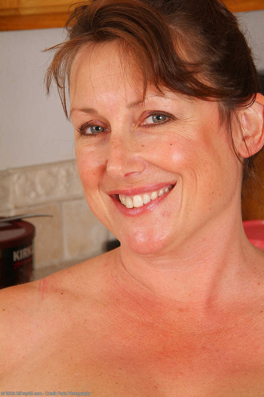 Chubby mature housewife Marishka touches her hairy pussy in the kitchenORMarishka's hairy mature kitchen strip tease ...