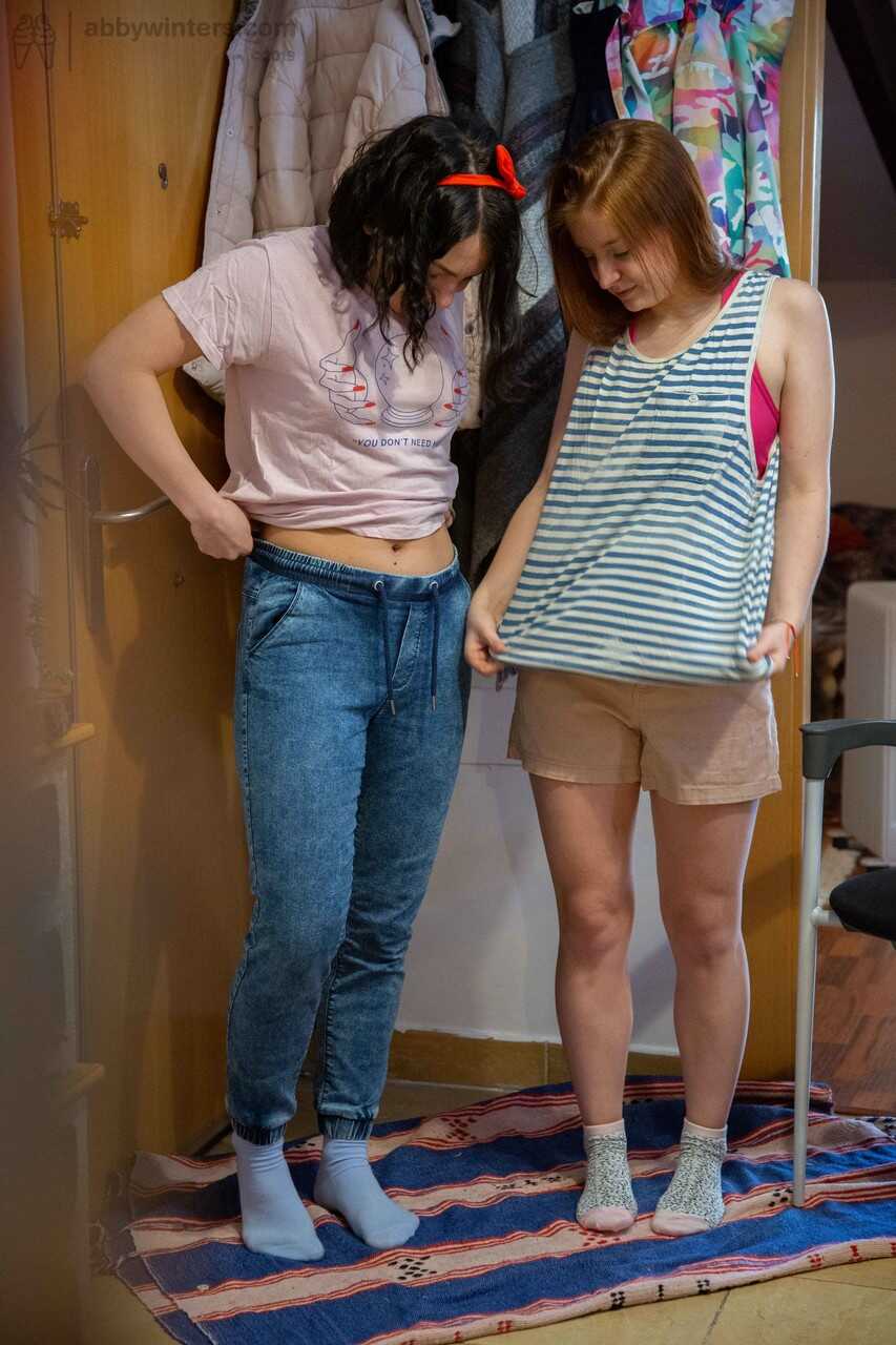 Teens Galina & Nina B show off their hot bodies as they put their clothes on and catch each other masturbating in tigh...