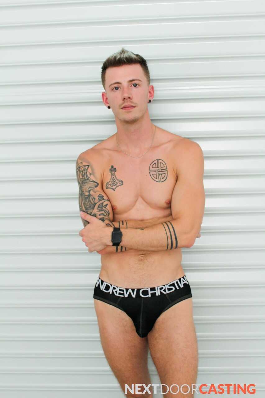 Tattooed hunk Dante Foxx jerks off on the sofa while playing with his massive cock - 