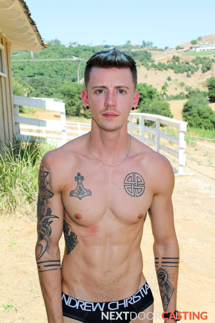 Tattooed hunk Dante Foxx jerks off on the sofa while playing with his massive cock - 