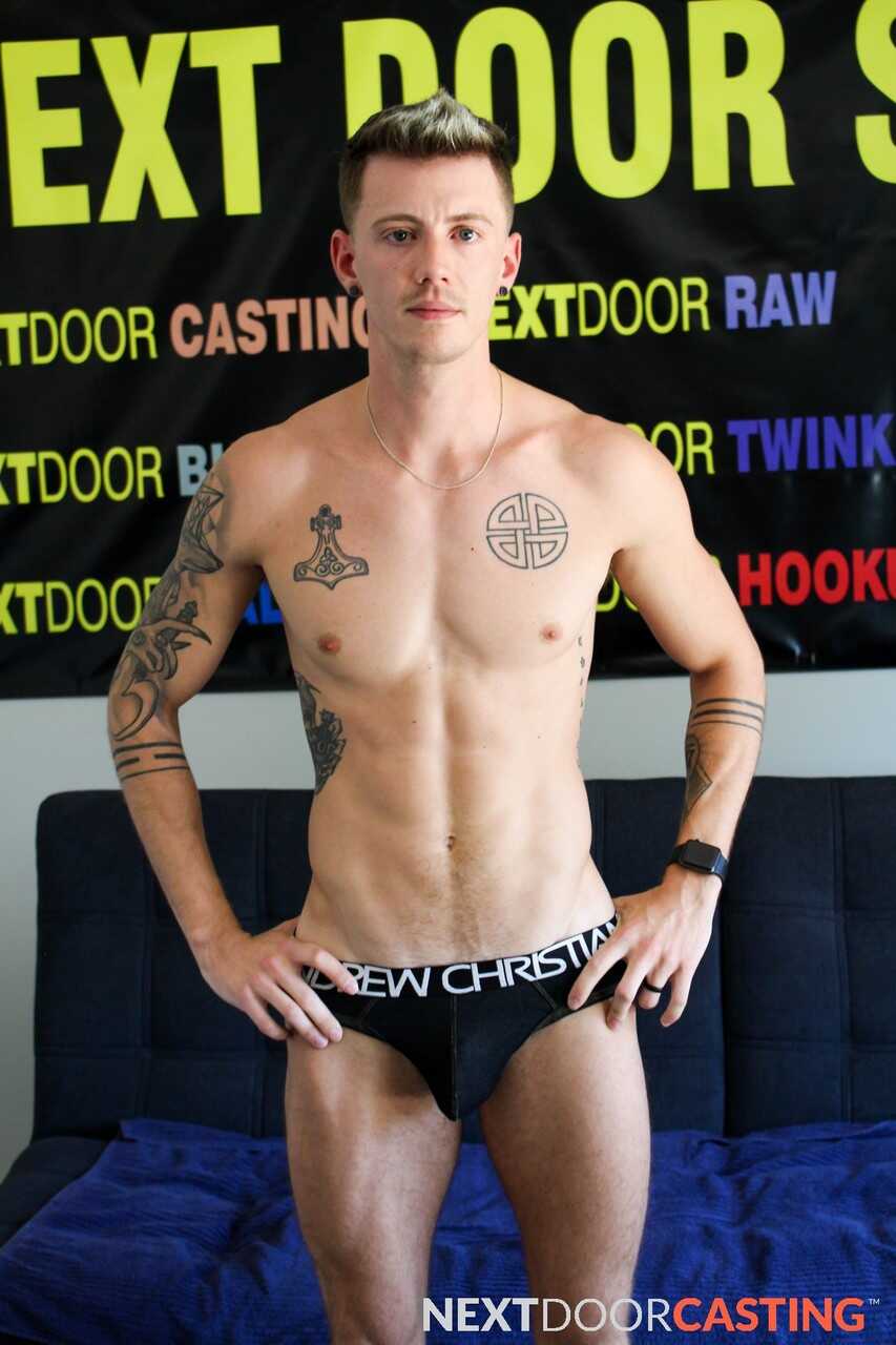 Tattooed hunk Dante Foxx jerks off on the sofa while playing with his massive cock - 