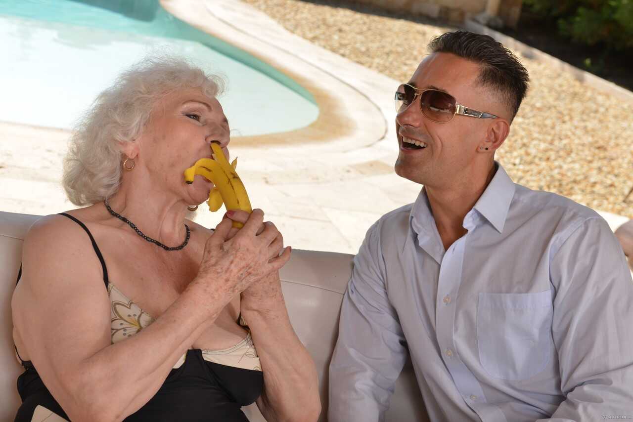 Grey haired granny Norma B gets pleasured by a young stud on her hairy cunt while taking a dip in the pool - Mugur, Norma B