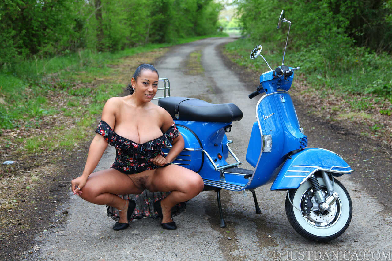 Curvy MILF Danica Collins shows her giant tits on a motorcycle in the woods! - Danica Collins